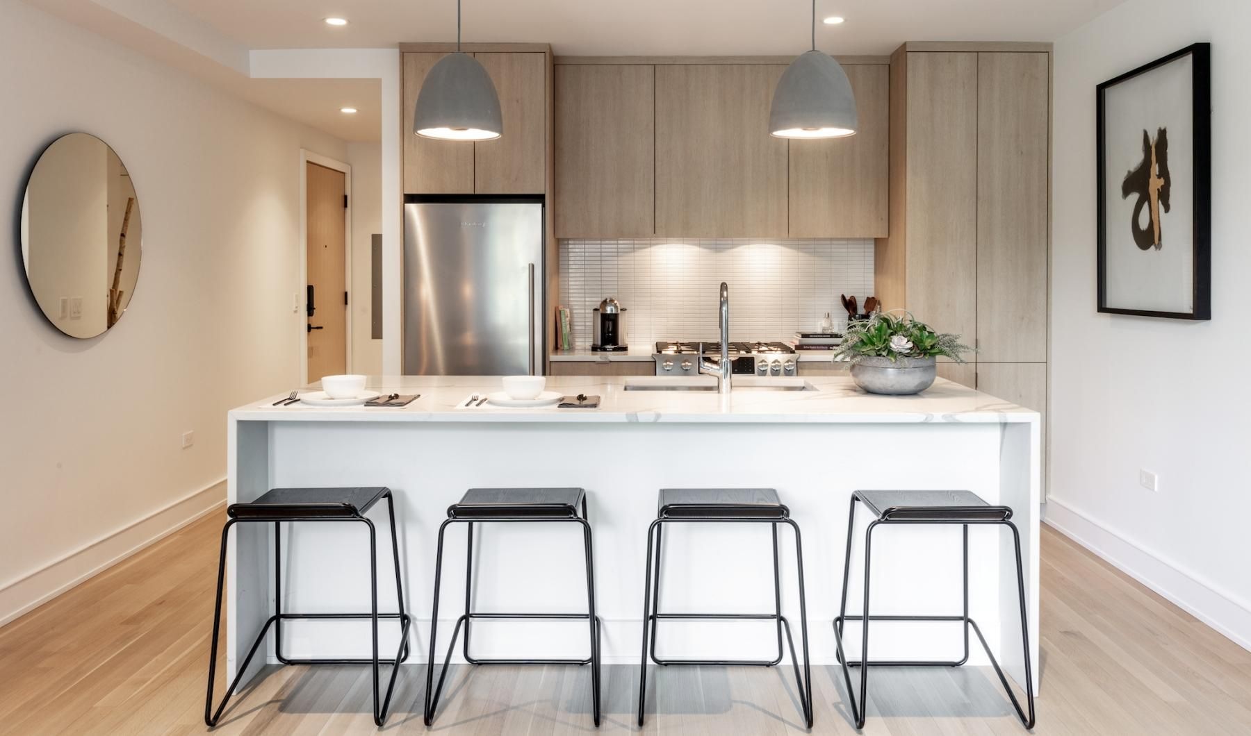 a kitchen with bar stools