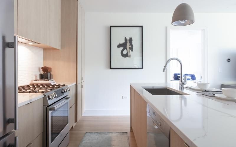 a kitchen with a stove and a sink